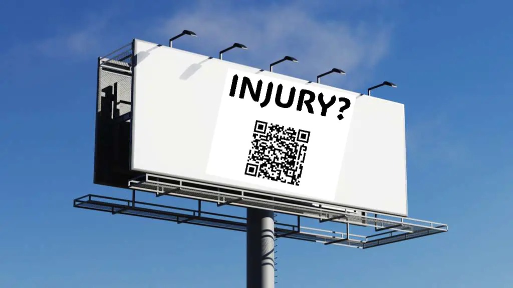 Highway billboard with INJURY? headline and QR code for personal injury law firm outdoor advertising