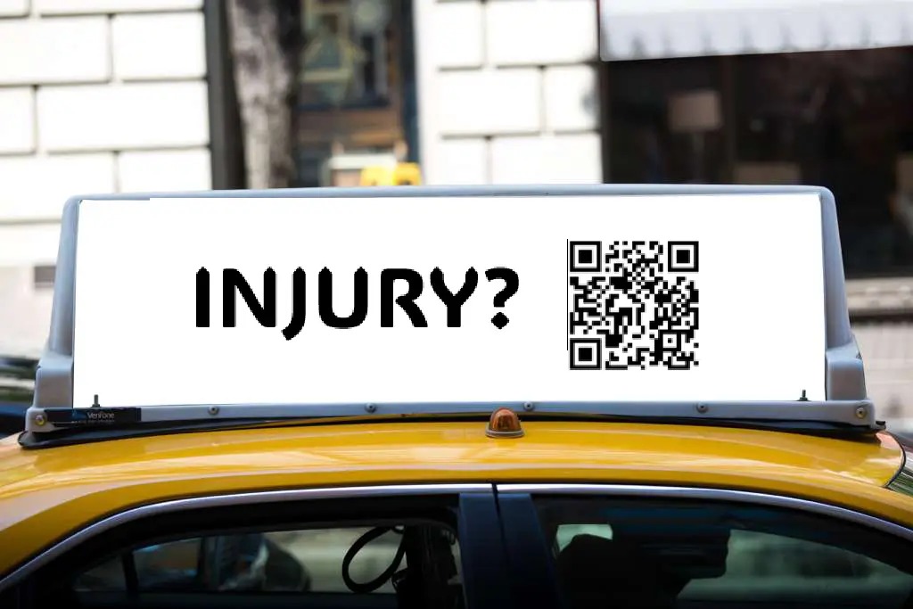 Yellow taxi rooftop ad with INJURY? headline and QR code for personal injury law firm advertising